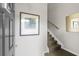 Entryway with stairs, modern wall art and neutral paint, creating a bright and inviting space at 1225 Blakeway St # 407, Charleston, SC 29492