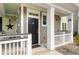 Up close view of the front door and porch area, showing the unit's entrance and trim details at 1225 Blakeway St # 407, Charleston, SC 29492