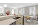 Bright kitchen featuring modern countertops, stainless steel appliances, and a seamless flow into the living space at 1225 Blakeway St # 407, Charleston, SC 29492