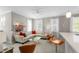 Open-concept living space with modern furniture, bright windows, and stylish decor, ideal for gatherings at 1225 Blakeway St # 407, Charleston, SC 29492