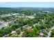This aerial view shows the community is full of trees, shops, and homes with beautiful waterfront views at 1416 Glencoe Dr, Mount Pleasant, SC 29464