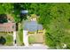Aerial view showcasing a property with a well-kept yard, deck, shed and a driveway with ample parking at 1416 Glencoe Dr, Mount Pleasant, SC 29464