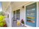 Inviting front porch with chairs and a teal door at 1416 Glencoe Dr, Mount Pleasant, SC 29464