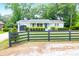 Charming gray home with dark fence, green lawn, and landscaping at 1416 Glencoe Dr, Mount Pleasant, SC 29464