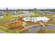 Aerial view of community pool with playground and lakeside homes, showcasing the neighborhood's recreational amenities and serene setting at 148 Haverhill St, Summerville, SC 29486
