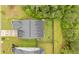 Aerial view of a home with a well-manicured lawn, mature trees, and a stone patio, providing a private outdoor space at 148 Haverhill St, Summerville, SC 29486
