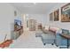 Finished basement with a sectional sofa, movie poster decor, and large screen television at 148 Haverhill St, Summerville, SC 29486