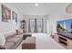 Spacious basement featuring a comfortable sectional sofa, plush carpeting, and a large screen television at 148 Haverhill St, Summerville, SC 29486