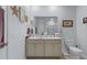 Bright bathroom with a double vanity, a large mirror, and ample counter space at 148 Haverhill St, Summerville, SC 29486