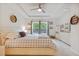 Serene bedroom with a ceiling fan and scenic views from the windows at 148 Haverhill St, Summerville, SC 29486