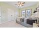 Bright bedroom with a queen bed, ceiling fan, and double closet creating a serene retreat at 148 Haverhill St, Summerville, SC 29486