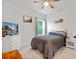 Cozy bedroom with a wood-frame bed, television, and a window creating a comfortable space at 148 Haverhill St, Summerville, SC 29486