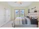 Light-filled bedroom with a queen bed, and double closet, creating a cozy and inviting space at 148 Haverhill St, Summerville, SC 29486