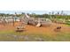 Outdoor playground with unique wooden play structures and seating, fostering a fun and engaging recreational area for children at 148 Haverhill St, Summerville, SC 29486