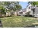Spacious backyard with lush green lawn and mature trees, perfect for outdoor activities at 1517 Faith St, Mount Pleasant, SC 29466