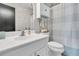 Bathroom featuring white vanity, toilet, and shower with blue and white striped curtain at 1517 Faith St, Mount Pleasant, SC 29466