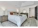 Spacious bedroom with two nightstands, plush rug, and dresser with elegant round mirror at 1517 Faith St, Mount Pleasant, SC 29466