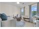 Comfortable Bedroom with daybed, cozy chair, crib, and lots of natural light from the windows at 1517 Faith St, Mount Pleasant, SC 29466
