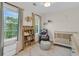 Cozy bedroom with natural light, wooden bookshelf, glider chair, and white crib at 1517 Faith St, Mount Pleasant, SC 29466
