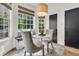 Charming breakfast nook with banquette seating, pendant lighting, and light wood floors with backyard view at 1517 Faith St, Mount Pleasant, SC 29466