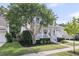 Charming home with a classic white porch, mature trees, and landscaped front yard at 1517 Faith St, Mount Pleasant, SC 29466