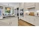 Modern kitchen with an island, stainless steel appliances, white cabinetry, and an adjacent breakfast nook at 1517 Faith St, Mount Pleasant, SC 29466