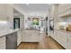 Modern kitchen with white cabinetry, marble countertops, stainless steel appliances, and hardwood floors at 1517 Faith St, Mount Pleasant, SC 29466