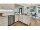Stylish kitchen with white cabinets, marble countertops, stainless steel appliances, and modern fixtures at 1517 Faith St, Mount Pleasant, SC 29466