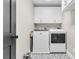 Functional laundry room with new washer and dryer units and overhead cabinets at 1517 Faith St, Mount Pleasant, SC 29466