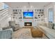 Cozy living room features a fireplace, built-in shelving, and plush seating with a patterned rug at 1517 Faith St, Mount Pleasant, SC 29466