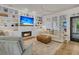 Spacious living room featuring a fireplace, built-in shelving, comfortable seating, and ample natural light at 1517 Faith St, Mount Pleasant, SC 29466