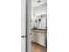 Bathroom featuring granite countertops, white cabinetry, and a large mirror at 1527 Wando View St, Charleston, SC 29492