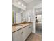 Bathroom with double sinks, granite countertops, and a view into the bedroom at 1527 Wando View St, Charleston, SC 29492