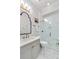 Elegant bathroom showcases a glass shower, intricate wallpaper, and mosaic tile flooring at 1527 Wando View St, Charleston, SC 29492