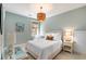 Bedroom featuring neutral walls and carpet with a striking wicker light fixture at 1527 Wando View St, Charleston, SC 29492