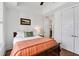 Bright bedroom features a tray ceiling, stylish furnishings, and ensuite bathroom access at 1527 Wando View St, Charleston, SC 29492