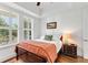 Bright bedroom with tray ceiling and plantation shutters at 1527 Wando View St, Charleston, SC 29492