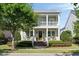 Inviting two-story home with a covered porch, manicured landscaping, and a charming entrance at 1527 Wando View St, Charleston, SC 29492