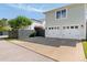 Two car garage with a concrete driveway and dark wooden fence at 1527 Wando View St, Charleston, SC 29492