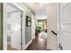 Hallway with stylish wallpaper, hardwood floors, and natural light at 1527 Wando View St, Charleston, SC 29492