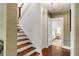 Hallway featuring hardwood floors, stairs, and an open doorway to the bedroom at 1527 Wando View St, Charleston, SC 29492