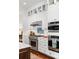Close up of kitchen appliances, including stainless steel oven, range, and custom cabinetry at 1527 Wando View St, Charleston, SC 29492