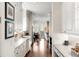 Bright kitchen with white cabinetry, marble countertops, stainless steel appliances, and hardwood floors at 1527 Wando View St, Charleston, SC 29492