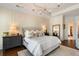 Large main bedroom with tray ceiling, decorative molding, and lots of natural light at 1527 Wando View St, Charleston, SC 29492