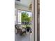 Covered porch featuring outdoor furniture and views of the landscaped yard at 1527 Wando View St, Charleston, SC 29492