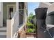 Landscaped side yard with screened porch, garden, and black fence at 1527 Wando View St, Charleston, SC 29492