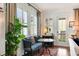 Cozy sitting area with a settee, natural light, and views to the outdoors at 1527 Wando View St, Charleston, SC 29492