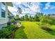 Beautiful backyard with a stone patio, green grass, and a swimming pool at 1545 Calaveras Cir, Mount Pleasant, SC 29466