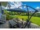 Inviting backyard patio with an umbrella, green grass, and a view of the pool at 1545 Calaveras Cir, Mount Pleasant, SC 29466
