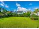 Large, well-maintained backyard with a black fence and lush landscaping at 1545 Calaveras Cir, Mount Pleasant, SC 29466